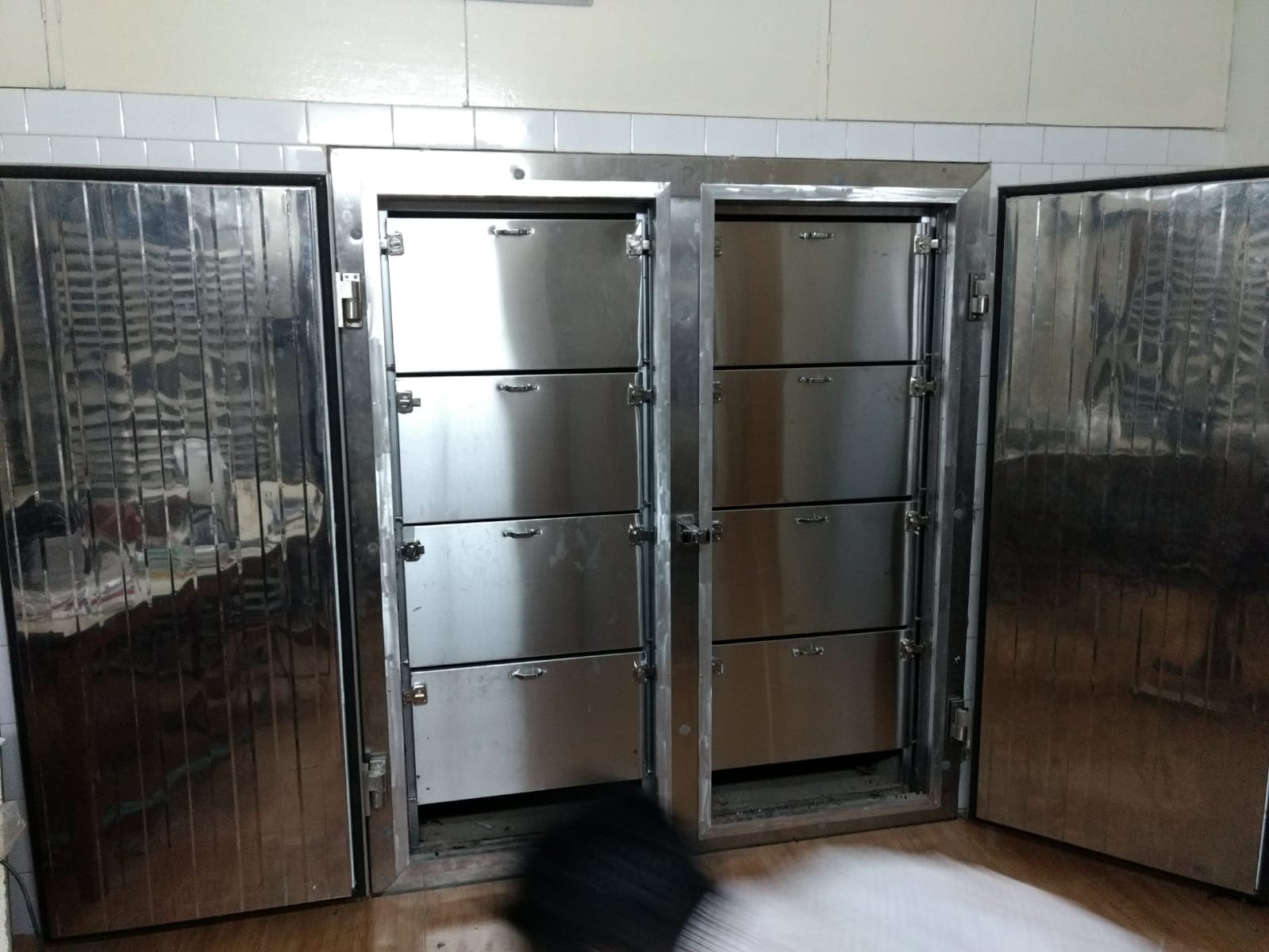 Mortuary cold room with ten numbered stainless steel compartment doors
